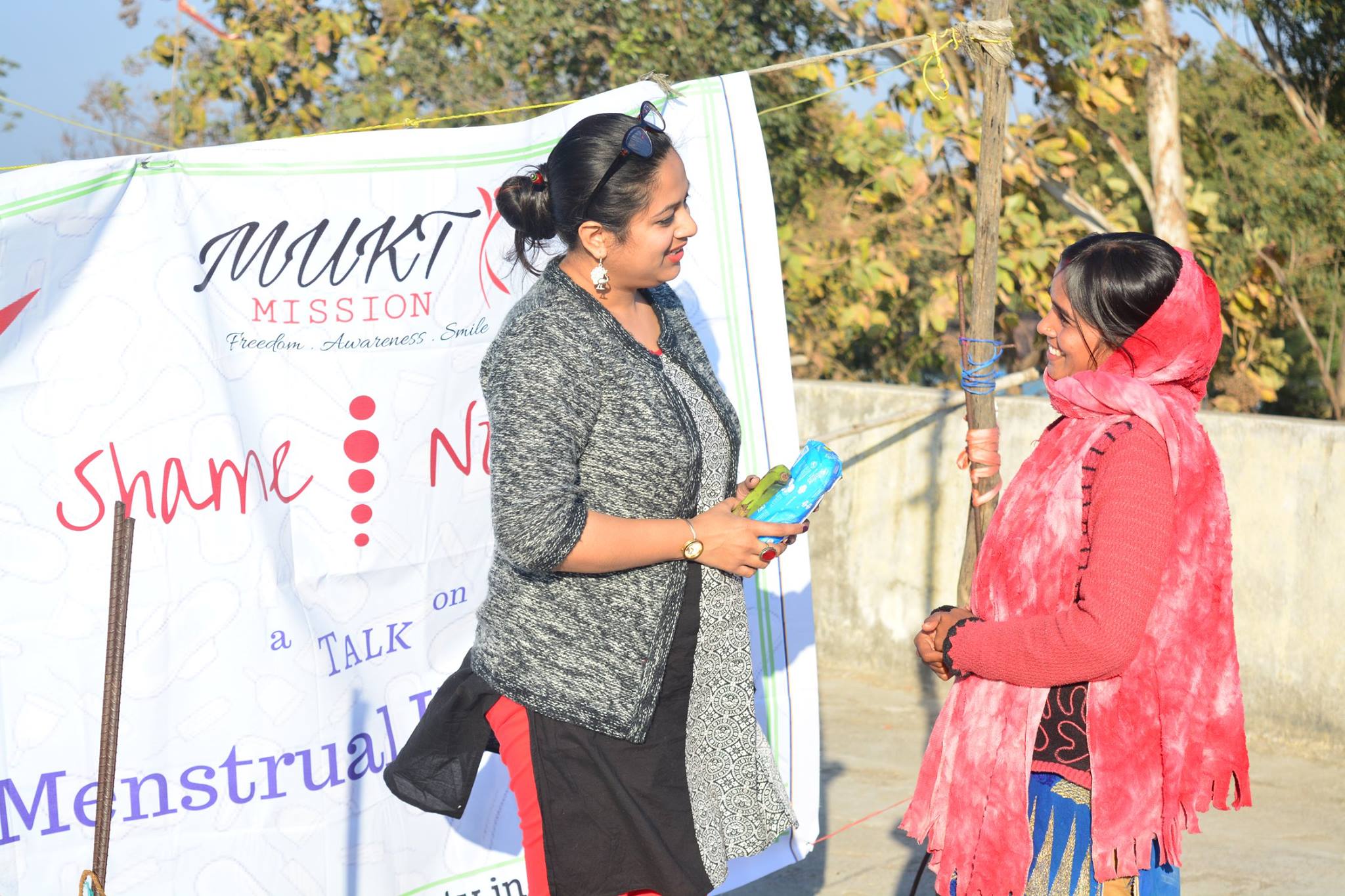 Rashmi shah in a conversation with a attendee in a session 