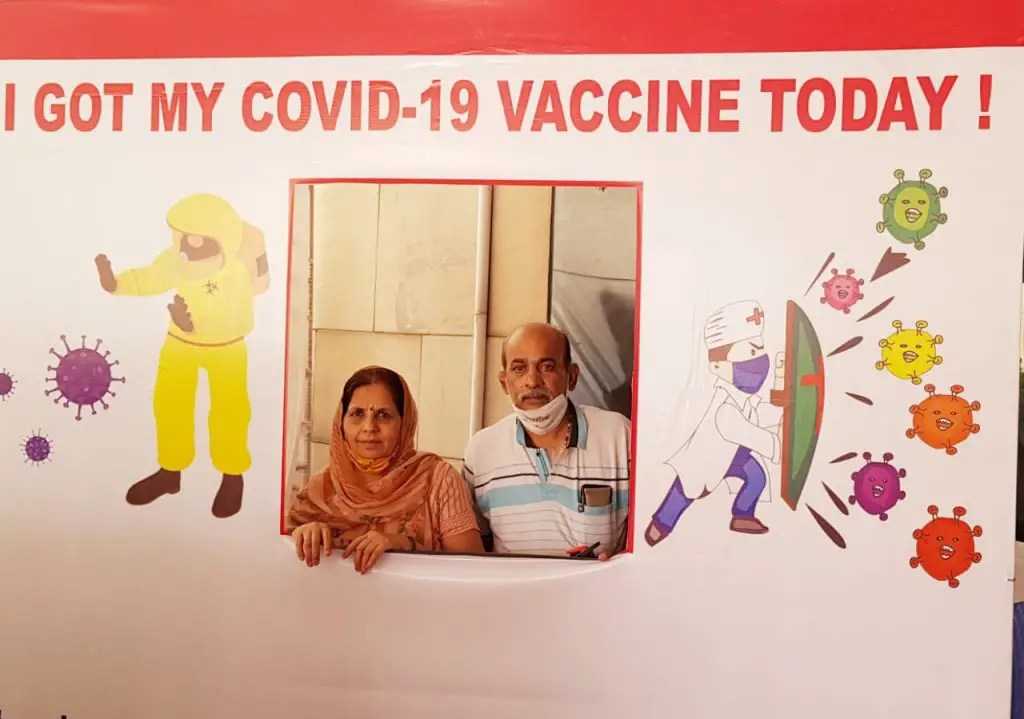 A couple in Delhi after getting vaccinated , motivating others 